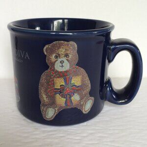 Godiva Chocolatier Christmas Coffee Mug Blue Teddy Bear Toys Train Drum 10 oz
